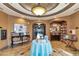 Library with bookshelves, tables, and comfortable seating at 7112 Marsh View Ter, Bradenton, FL 34212