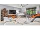 Spacious living room with sectional sofa, large TV, and access to patio at 7112 Marsh View Ter, Bradenton, FL 34212