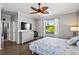 Main bedroom with a TV, dresser, and calming decor at 7112 Marsh View Ter, Bradenton, FL 34212