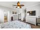 Spacious main bedroom with large TV and ample dresser storage at 7112 Marsh View Ter, Bradenton, FL 34212