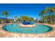 Resort-style pool with blue ceramic bowls and lounge chairs at 7112 Marsh View Ter, Bradenton, FL 34212