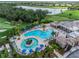 Aerial view of resort-style pool with surrounding lounge chairs at 7112 Marsh View Ter, Bradenton, FL 34212