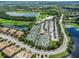 Aerial view of tennis courts near a clubhouse and parking lot at 7112 Marsh View Ter, Bradenton, FL 34212