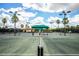 Multiple tennis courts with shade structures at 7112 Marsh View Ter, Bradenton, FL 34212