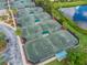 An aerial view of several tennis courts in a community at 7112 Marsh View Ter, Bradenton, FL 34212