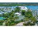 Aerial view of community tennis courts and lush landscaping at 1260 Dolphin Bay Way # 203, Sarasota, FL 34242