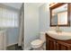 Bathroom with vanity, toilet, shower, and slate flooring at 329 Bay Vista Ave, Osprey, FL 34229