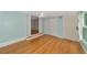 Bedroom with hardwood floors, ceiling fan, and ample closet space at 329 Bay Vista Ave, Osprey, FL 34229