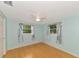 Bedroom with hardwood floors, ceiling fan, and light blue walls at 329 Bay Vista Ave, Osprey, FL 34229