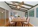 Sunlit dining room, featuring a wood table and six chairs at 329 Bay Vista Ave, Osprey, FL 34229