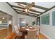 Dining room features hardwood floors, a wood table, and ceiling fan at 329 Bay Vista Ave, Osprey, FL 34229