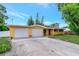 Charming ranch home with attached two-car garage and well-manicured lawn at 329 Bay Vista Ave, Osprey, FL 34229