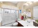 A well-organized bathroom with a glass shower, a toilet, a sink, and soft natural light at 105 New Briton Ct, Bradenton, FL 34212