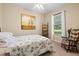 Bedroom featuring a bed, ladder shelf, a comfortable chair, and a window at 105 New Briton Ct, Bradenton, FL 34212