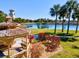 Relaxing gazebo with a view of the lake and tropical landscaping at 105 New Briton Ct, Bradenton, FL 34212