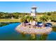 Aerial view of a community lighthouse on a tiny island at 105 New Briton Ct, Bradenton, FL 34212