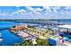 Overhead view of marina and waterfront restaurant with boats docked along the pier at 105 New Briton Ct, Bradenton, FL 34212