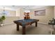 A recreation room featuring a pool table and bar stools provides an entertainment space at 105 New Briton Ct, Bradenton, FL 34212