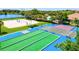 Recreational area with bocce ball, shuffleboard courts, beach volleyball courts, and seating at 105 New Briton Ct, Bradenton, FL 34212