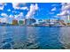 Waterfront view featuring luxury yachts docked with city skyline and vibrant blue sky at 105 New Briton Ct, Bradenton, FL 34212