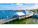 Scenic waterfront restaurant with dock access and outdoor seating overlooking bay at 105 New Briton Ct, Bradenton, FL 34212