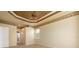 Well lit bedroom with ceiling fan and access to bathroom at 4140 Reflections Pkwy, Sarasota, FL 34233