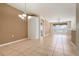 Spacious dining area with tile floors and a chandelier at 4140 Reflections Pkwy, Sarasota, FL 34233