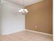A bright, spacious dining area with a chandelier at 4140 Reflections Pkwy, Sarasota, FL 34233
