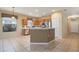 Kitchen with island, stainless steel appliances, and oak cabinets at 4140 Reflections Pkwy, Sarasota, FL 34233
