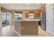 Kitchen features island, stainless steel appliances, and oak cabinets at 4140 Reflections Pkwy, Sarasota, FL 34233