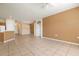 Living room with tile floors and access to dining area at 4140 Reflections Pkwy, Sarasota, FL 34233