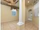 Home office features decorative columns and a ceiling fan at 4140 Reflections Pkwy, Sarasota, FL 34233
