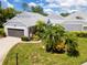 Charming villa with gray siding, lush landscaping, and a two-car garage at 3423 52Nd Avenue W Cir # 267, Bradenton, FL 34210