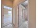 Hallway with doors leading to a bathroom and a bedroom with a view of the backyard at 3108 Royal Palm Dr, North Port, FL 34288