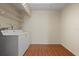 Laundry room with washer, dryer, and wood-look flooring at 4109 66Th Street W Cir # 4109, Bradenton, FL 34209