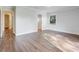 Bedroom with hardwood floors, natural light from the window and view of the ensuite bath at 1741 Jewel Dr, Sarasota, FL 34240