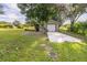 Detached garage with a single-car garage door and covered patio at 1741 Jewel Dr, Sarasota, FL 34240