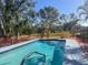 The private in-ground pool offers a place to relax on a sunny day at 1741 Jewel Dr, Sarasota, FL 34240