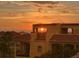 Golden sunset peeks through the rooftops of a lovely neighborhood with balconies overlooking ocean views at 1450 Silvia Shores Dr, Apollo Beach, FL 33572