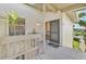 Condo entry with private deck and tropical plants at 26336 Nadir Rd # 12, Punta Gorda, FL 33983