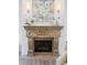 Ornate fireplace mantel is a focal point in this room at 3482 Flamingo Ave, Sarasota, FL 34242