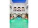 Large indoor pool surrounded by a two-story structure at 3482 Flamingo Ave, Sarasota, FL 34242