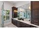 Elegant Primary bath with double vanity and marble countertops at 3482 Flamingo Ave, Sarasota, FL 34242