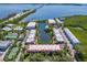 Aerial view showing the community's location near the water and bridge at 3705 E Bay Dr # 115, Holmes Beach, FL 34217