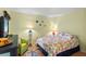 Charming bedroom with a queen-size bed and coastal decor at 3705 E Bay Dr # 115, Holmes Beach, FL 34217