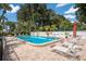 Inviting community pool with plenty of lounge chairs for relaxation at 3705 E Bay Dr # 115, Holmes Beach, FL 34217