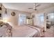 Main bedroom with a queen-size bed and white dresser at 6428 Fleetwood Ct, North Port, FL 34287