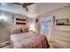 Main bedroom with a queen-size bed and a dresser at 6428 Fleetwood Ct, North Port, FL 34287