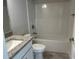 Bathroom with granite countertop and tub/shower combo at 8005 Tropicaire Blvd, North Port, FL 34291