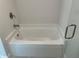 White bathtub with brushed nickel faucet at 8005 Tropicaire Blvd, North Port, FL 34291